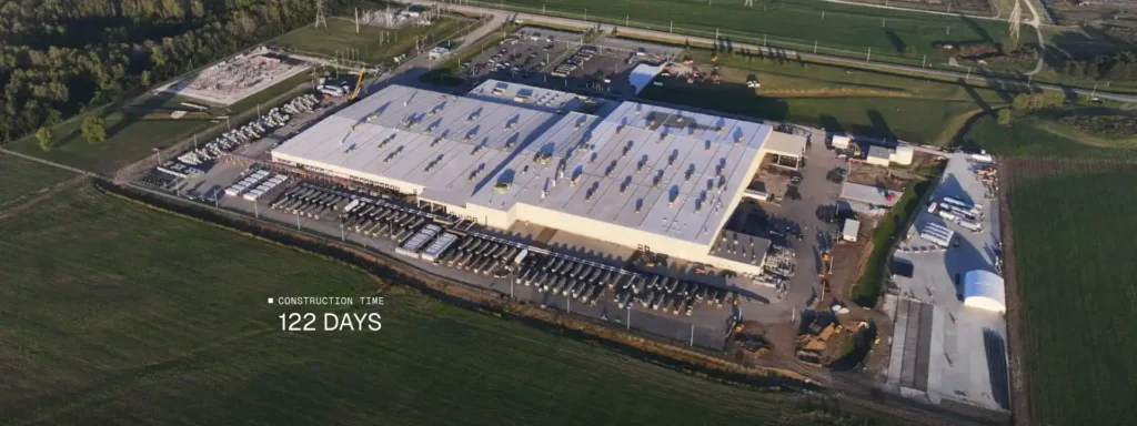 Aerial visualization of the xAI solar farm beside the Colossus data center in Memphis, showing an 88-acre solar array supporting AI infrastructure.